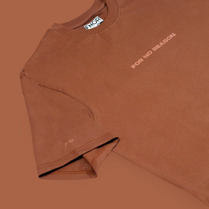 Flat lay of coffee brown FNOR oversized t-shirt showcasing minimalist design.